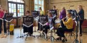 The ensemble earning their cream tea